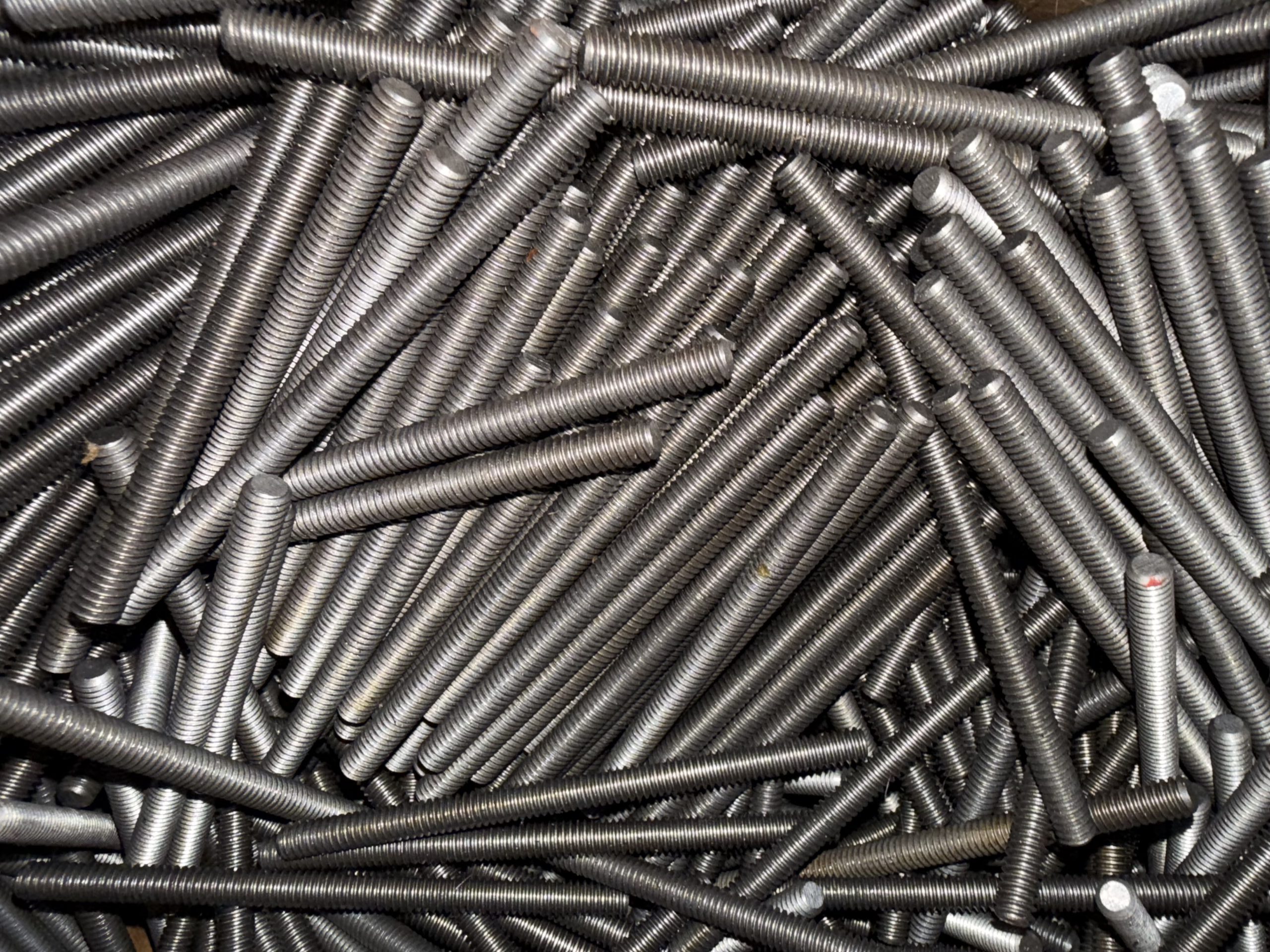 High-strength industrial stud bolts grouped together for heavy-duty applications